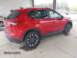 2016 Mazda CX-5 Grand Touring with VIN JM3KE4DY3G0688062, listed as a IAAI auction lot 42025169 with 59,867 mi miles and . Bid and sale history available at carsss.com. Image 4.