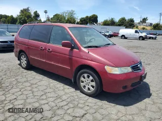 2004 Honda Odyssey EX-L with VIN 5FNRL18014B031578, listed as a Copart auction lot 56938795 with 241,085 mi miles and Salvage title. Bid and sale history available at DreamBid. Image 4.