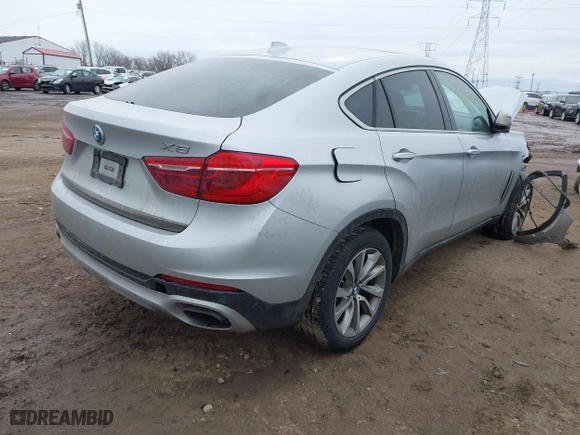 2018 BMW X6 xDrive35i with VIN 5UXKU2C50J0X49445, listed as a IAAI auction lot 41449077 with 130,912 mi miles. Bid and sale history available at carsss.com. Image 4.
