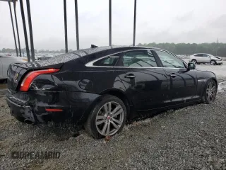 2014 Jaguar XJ Portfolio with VIN SAJWJ2GD5E8V69982, listed as a Copart auction lot 58933515 with 92,847 mi miles and Salvage title. Bid and sale history available at DreamBid. Image 3.