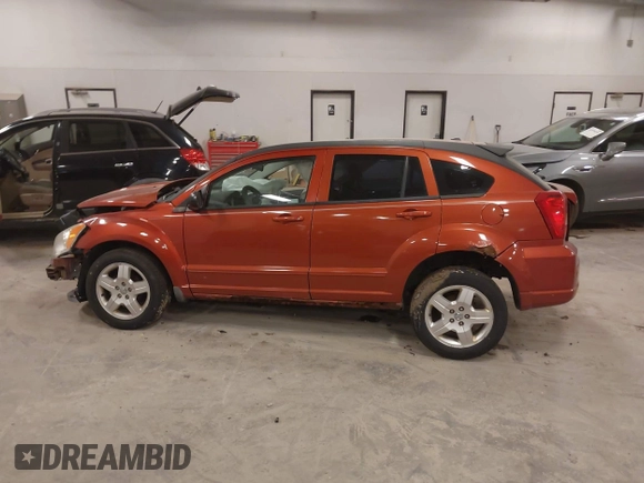 2009 Dodge Caliber SXT with VIN 1B3HB48A59D168273, listed as a IAAI auction lot 41988835 with 200,125 mi miles and . Bid and sale history available at DreamBid. Image 14.