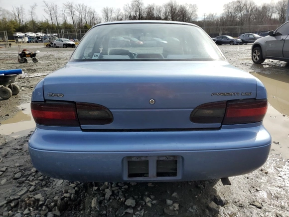 1996 Geo Prizm z VIN 1Y1SK5265TZ070025, wystawiony jako Copart lot #44045725 z przebiegiem 183 385 mil mil oraz Szkody całkowita. Historia ofert i sprzedaży dostępna na DreamBid. Obrazek 6.