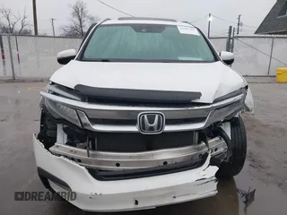 2021 Honda Pilot Touring 8-Passenger z VIN 5FNYF6H90MB031795, wystawiony jako IAAI lot #41207263 z przebiegiem 56 367 mil mil oraz . Historia ofert i sprzedaży dostępna na DreamBid. Obrazek 13.