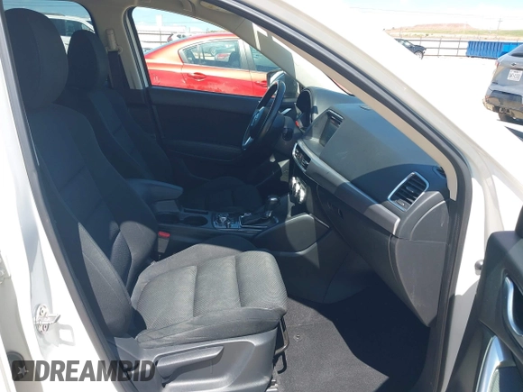 2016 Mazda CX-5 Touring z VIN JM3KE2CY0G0840918, wystawiony jako IAAI lot #42205529 z przebiegiem 74 515 mil mil oraz . Historia ofert i sprzedaży dostępna na DreamBid. Obrazek 5.