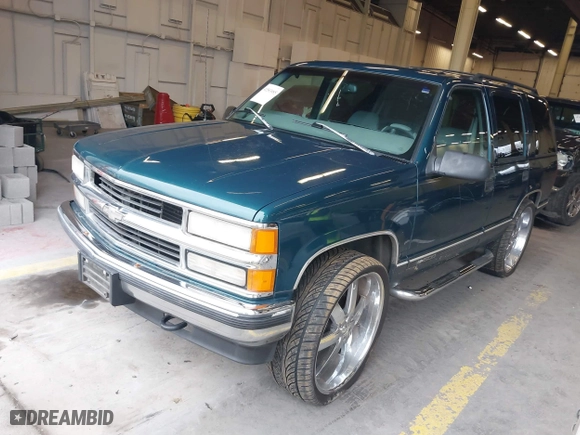 1997 Chevrolet Tahoe with VIN 1GNEK13R8VJ411512, listed as a IAAI auction lot 41583085 with 239,481 mi miles. Bid and sale history available at carsss.com. Image 2.