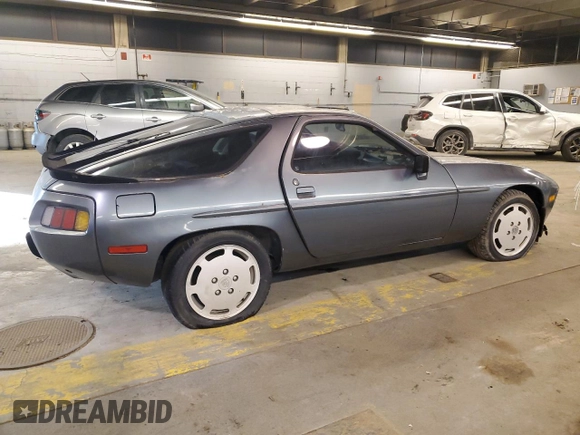 1984 Porsche 928 z VIN WP0JB0925ES861303, wystawiony jako Copart lot #41979575 z przebiegiem 114 593 mil mil oraz Nie do naprawy • Non repairable. Historia ofert i sprzedaży dostępna na DreamBid. Obrazek 3.