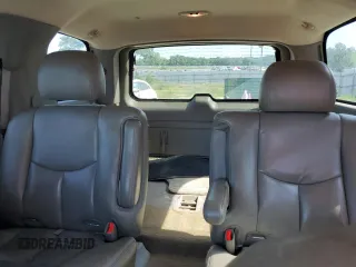 2005 GMC Yukon SLE z VIN 1GKEC13T75J179930, wystawiony jako Copart lot #57259205 z przebiegiem 310 454 mil mil oraz Szkody całkowita. Historia ofert i sprzedaży dostępna na DreamBid. Obrazek 10.
