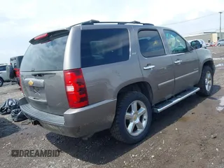 2013 Chevrolet Tahoe LTZ with VIN 1GNSKCE0XDR373858, listed as a IAAI auction lot 42456875 with 297,084 mi miles and . Bid and sale history available at DreamBid. Image 4.