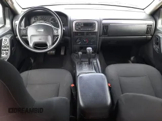 2004 Jeep Grand Cherokee Laredo with VIN 1J4GW48S34C339876, listed as a Copart auction lot 52428045 with 229,606 mi miles and Salvage Title. Bid and sale history available at carsss.com. Image 8.