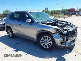 2015 Mazda CX-5 Sport z VIN JM3KE2BEXF0527431, wystawiony jako IAAI lot #41832024 z przebiegiem 131 215 mil mil oraz . Historia ofert i sprzedaży dostępna na DreamBid. Obrazek 1.