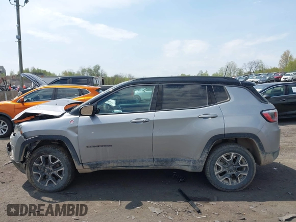 2020 Jeep Compass Trailhawk with VIN 3C4NJDDB4LT171685, listed as a IAAI auction lot 42168366 with 76,390 mi miles and . Bid and sale history available at DreamBid. Image 14.