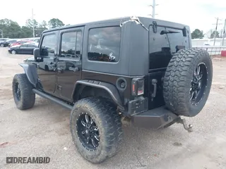 2016 Jeep Wrangler Unlimited 75th Anniversary with VIN 1C4BJWEG2GL158850, listed as a IAAI auction lot 41472080 with 109,789 mi miles. Bid and sale history available at carsss.com. Image 3.