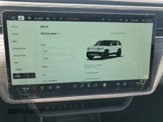 2025 Rivian R1S Adventure z VIN 7PDSGBBA1SN051768, wystawiony jako Copart lot #43838115 z przebiegiem 4875 mil mil oraz Szkoda całkowita • Salvage title. Historia ofert i sprzedaży dostępna na DreamBid. Obrazek 9.