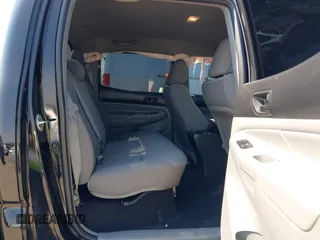 2014 Toyota Tacoma PreRunner with VIN 3TMKU4HN0EM040104, listed as a IAAI auction lot 41619179 with 171,542 mi miles and . Bid and sale history available at DreamBid. Image 8.
