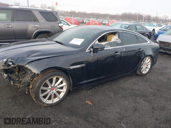 2014 Jaguar XJ with VIN SAJWA1CZXE8V74400, listed as a IAAI auction lot 38250698 with 102,205 mi miles and . Bid and sale history available at DreamBid. Image 2.