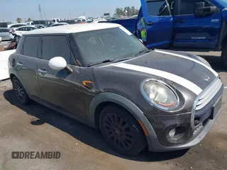 2015 MINI Hardtop 4 Door with VIN WMWXS5C55FT830653, listed as a IAAI auction lot 42721174 with 126,298 mi miles and . Bid and sale history available at DreamBid. Image 1.