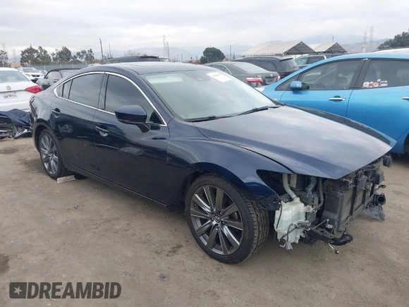2018 Mazda 6 Grand Touring with VIN JM1GL1TY3J1334600, listed as a IAAI auction lot 41060893 with 64,852 mi miles and . Bid and sale history available at DreamBid. Image 1.
