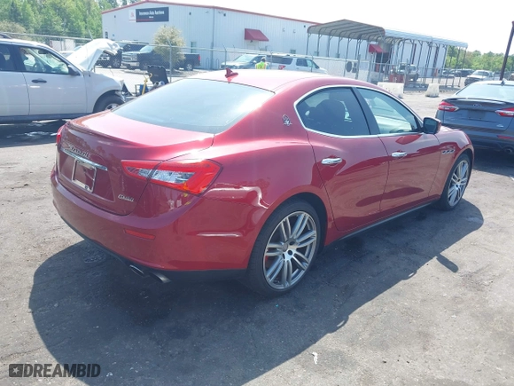 2015 Maserati Ghibli with VIN ZAM57XSA5F1129883, listed as a IAAI auction lot 41920750 with 63,739 mi miles. Bid and sale history available at carsss.com. Image 4.