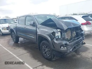 2021 Toyota Tacoma 4WD SR with VIN 3TMCZ5ANXMM415436, listed as a IAAI auction lot 41728288 with 68,189 mi miles. Bid and sale history available at carsss.com. Image 1.