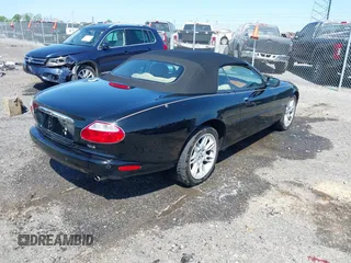 2002 Jaguar XK with VIN SAJDA42C12NA30499, listed as a IAAI auction lot 41954577 with 77,152 mi miles and . Bid and sale history available at DreamBid. Image 4.