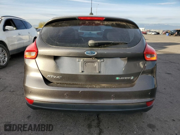 2015 Ford Focus Electric with VIN 1FADP3R40FL348785, listed as a Copart auction lot 84516374 with 85,633 mi miles and Salvage title. Bid and sale history available at DreamBid. Image 6.