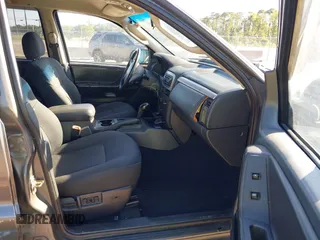 2002 Jeep Grand Cherokee z VIN 1J4GX38S32C238339, wystawiony jako IAAI lot #42653341 z przebiegiem 264 189 mil mil oraz . Historia ofert i sprzedaży dostępna na DreamBid. Obrazek 5.