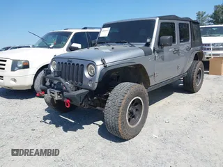 2014 Jeep Wrangler Unlimited Sport with VIN 1C4BJWDG4EL292421, listed as a IAAI auction lot 42034343 with 157,820 mi miles. Bid and sale history available at carsss.com. Image 2.