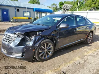 2013 Cadillac XTS Luxury z VIN 2G61P5S3XD9220071, wystawiony jako Copart lot #56207235 z przebiegiem 89 215 mil mil oraz Szkody całkowita. Historia ofert i sprzedaży dostępna na DreamBid. Obrazek 1.