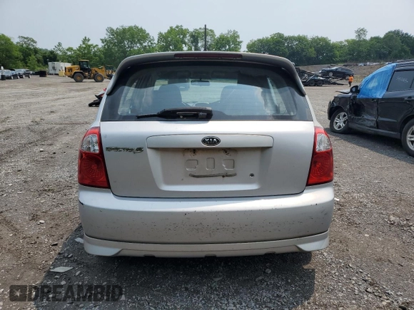 2005 Kia Spectra z VIN KNAFE162755170129, wystawiony jako Copart lot #60217065 z przebiegiem 94 458 mil mil oraz Szkoda całkowita • Salvage title. Historia ofert i sprzedaży dostępna na DreamBid. Obrazek 6.