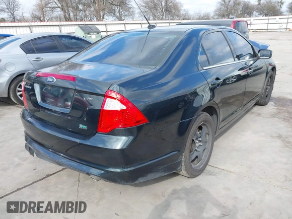 2010 Ford Fusion SE with VIN 3FAHP0HG5AR384834, listed as a IAAI auction lot 41533295 with 124,356 mi miles. Bid and sale history available at carsss.com. Image 4.