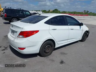 2014 Hyundai Accent GLS with VIN KMHCT4AE1EU590386, listed as a IAAI auction lot 42155202 with 248,545 mi miles. Bid and sale history available at carsss.com. Image 4.