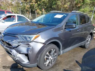 2016 Toyota RAV4 LE with VIN 2T3ZFREV7GW305998, listed as a IAAI auction lot 41869024 with 163,463 mi miles. Bid and sale history available at carsss.com. Image 2.