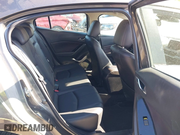 2018 Mazda 3 Touring with VIN 3MZBN1L34JM164952, listed as a IAAI auction lot 42179420 with 106,706 mi miles and . Bid and sale history available at DreamBid. Image 8.