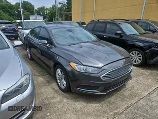 2018 Ford Fusion SE z VIN 3FA6P0HD9JR162701, wystawiony jako Copart lot #60118125 z przebiegiem 160 219 mil mil oraz Czysty tytuł • Clean title. Historia ofert i sprzedaży dostępna na DreamBid. Obrazek 1.