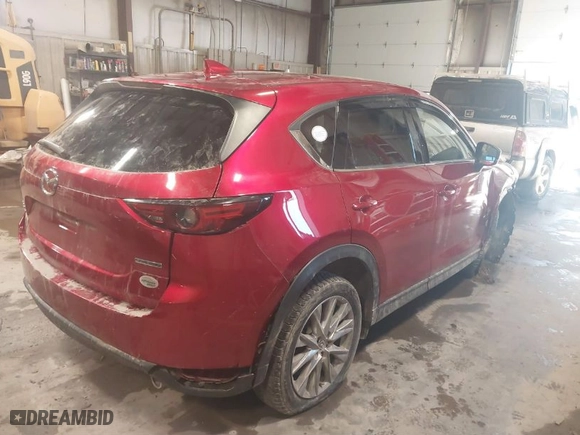 2021 Mazda CX-5 Grand Touring with VIN JM3KFBDMXM1430321, listed as a IAAI auction lot 41622134 with 44,955 mi miles. Bid and sale history available at carsss.com. Image 4.