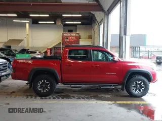 2019 Toyota Tacoma SR z VIN 3TMCZ5AN5KM220079, wystawiony jako IAAI lot #41856695 z przebiegiem 51 918 mil mil oraz . Historia ofert i sprzedaży dostępna na DreamBid. Obrazek 13.
