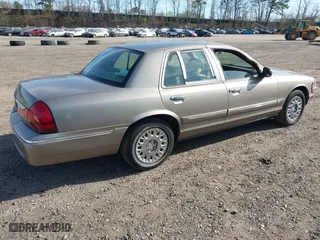 2003 Mercury Grand Marquis GS Convenience with VIN 2MEFM74W43X681774, listed as a IAAI auction lot 42057422 with 218,422 mi miles. Bid and sale history available at carsss.com. Image 4.