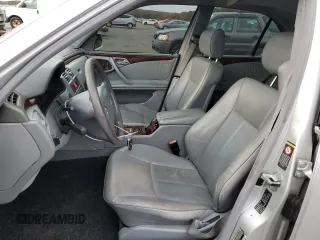 2000 Mercedes-Benz E-Class with VIN WDBJF65J8YB153103, listed as a Copart auction lot 80986234 with 144,205 mi miles and Salvage Title. Bid and sale history available at carsss.com. Image 7.