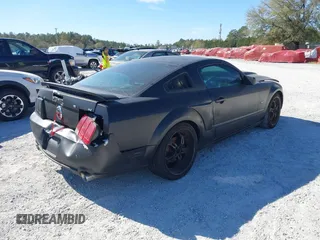 2005 Ford Mustang Deluxe with VIN 1ZVFT80N655136118, listed as a IAAI auction lot 41811969 with 104,071 mi miles. Bid and sale history available at carsss.com. Image 4.