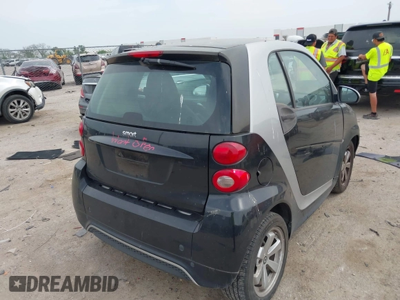 2013 Smart fortwo Pure with VIN WMEEJ3BA5DK620493, listed as a IAAI auction lot 42071086 with 85,883 mi miles and . Bid and sale history available at DreamBid. Image 4.