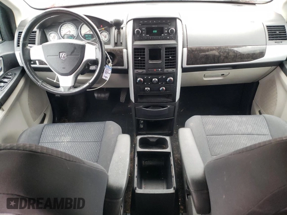 2010 Dodge Grand Caravan SXT z VIN 2D4RN5D10AR179773, wystawiony jako Copart lot #56855235 z przebiegiem 239 925 mil mil oraz Nie do naprawy • Non repairable. Historia ofert i sprzedaży dostępna na DreamBid. Obrazek 8.