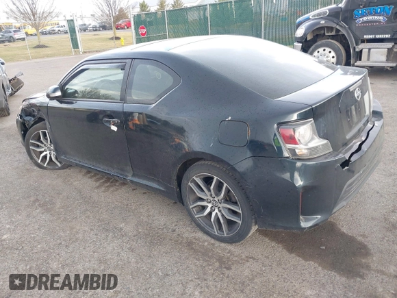 2015 Scion tC with VIN JTKJF5C7XFJ001662, listed as a IAAI auction lot 41843123 with 128,851 mi miles. Bid and sale history available at carsss.com. Image 3.