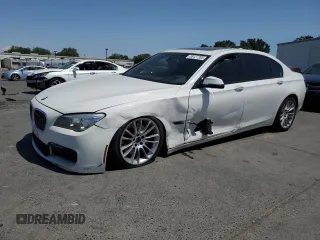 2014 BMW 7 Series 740Li with VIN WBAYE4C56ED138402, listed as a Copart auction lot 59127205 with 103,829 mi miles and Salvage title. Bid and sale history available at DreamBid. Image 1.