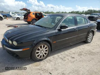 2003 Jaguar X-Type 2.5L Manual with VIN SAJEA51D73XD21289, listed as a Copart auction lot 59583194 with 70,333 mi miles and Clean Title. Bid and sale history available at DreamBid. Image 1.