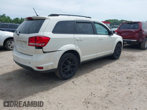2014 Dodge Journey SXT z VIN 3C4PDCBBXET135001, wystawiony jako IAAI lot #42318360 z przebiegiem 152 321 mil mil oraz . Historia ofert i sprzedaży dostępna na DreamBid. Obrazek 4.