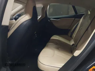 2014 Tesla Model S 60 with VIN 5YJSA1H11EFP56406, listed as a IAAI auction lot 42065157 with Not Provided miles and . Bid and sale history available at DreamBid. Image 8.