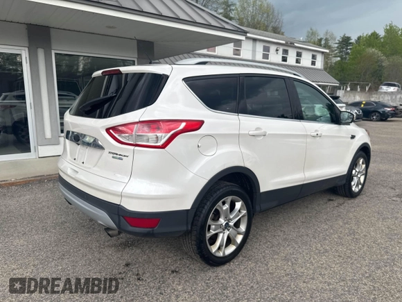 2014 Ford Escape Titanium with VIN 1FMCU9J94EUC63638, listed as a IAAI auction lot 42196241 with 198,112 mi miles and . Bid and sale history available at DreamBid. Image 4.