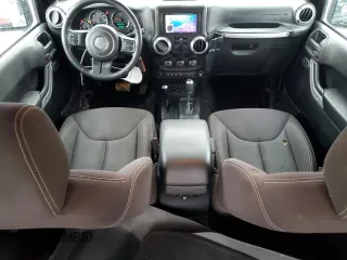 2014 Jeep Wrangler Sahara with VIN 1C4AJWBG0EL306703, listed as a Copart auction lot 51450215 with 115,932 mi miles and Salvage Title. Bid and sale history available at DreamBid. Image 8.