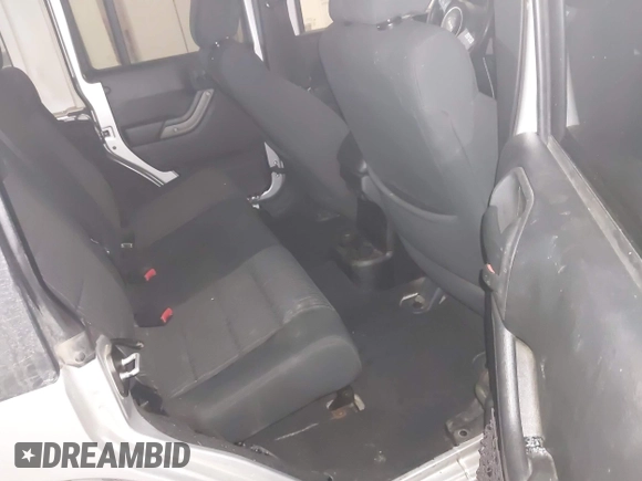 2012 Jeep Wrangler Unlimited Sport z VIN 1C4HJWDG3CL224800, wystawiony jako IAAI lot #41569279 z przebiegiem 174 336 mil mil oraz . Historia ofert i sprzedaży dostępna na DreamBid. Obrazek 8.
