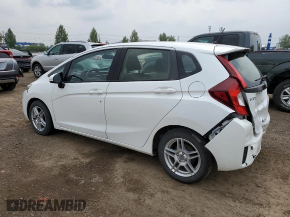 2016 Honda Fit LX with VIN JHMGK5H59GX004764, listed as a Copart auction lot 65131715 with 75,726 mi miles and Salvage title. Bid and sale history available at DreamBid. Image 2.
